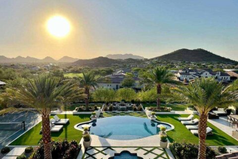 A Luxurious Home featuring a Beautifully Remodeled Pool and Expansive Lawn in Phoenix, AZ