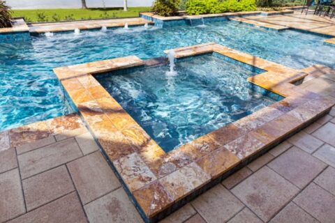 Custom swimming pool with spa and outdoor living space