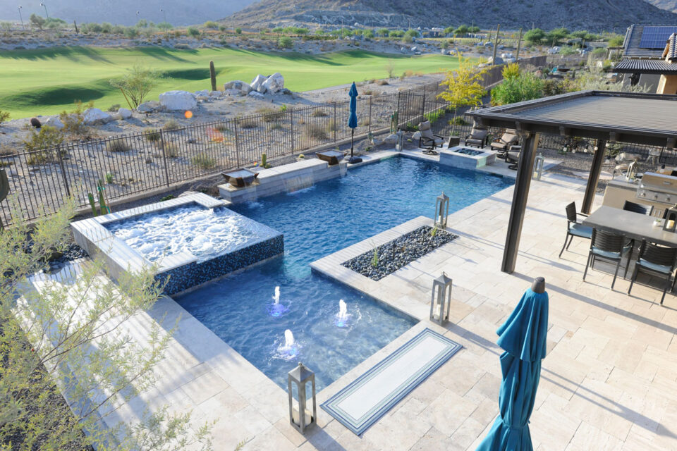 Small modern swimming pool built in a home with a seating area in Phoenix, AZ